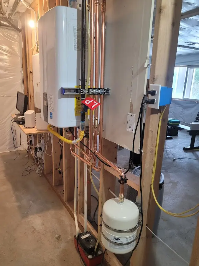 Licensed plumber repairing a kitchen sink in Aledo